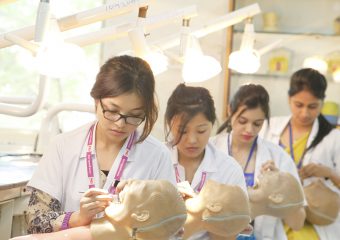 Dental students practicing